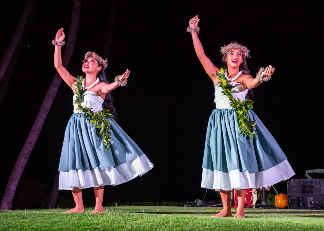 Hula dancers performing on the lawn at The Feast at Mokapu
